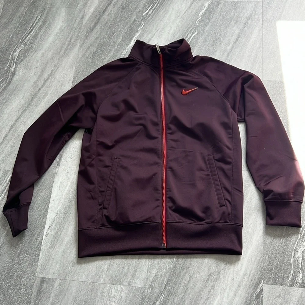Maroon Nike Jacket size XL Youth black and orange detailing fits womens M/L
